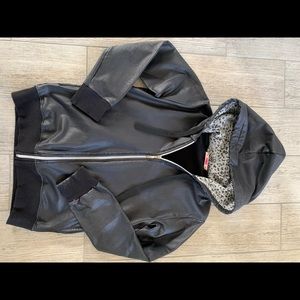 Zipped up jacket, leather effect